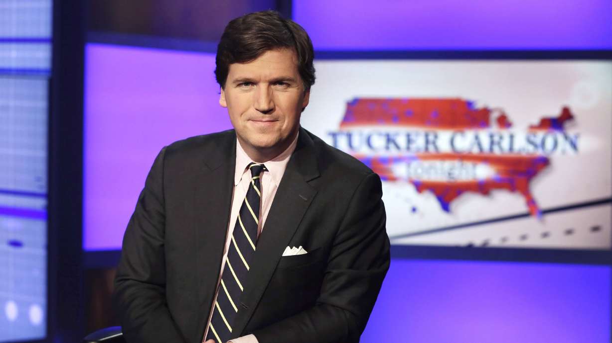 Tucker Carlson, host of "Tucker Carlson Tonight," poses for photos in a Fox News Channel studio on March 2, 2017, in New York. Carlson and Fox News have severed ties, the network said in a stunning announcement Monday.