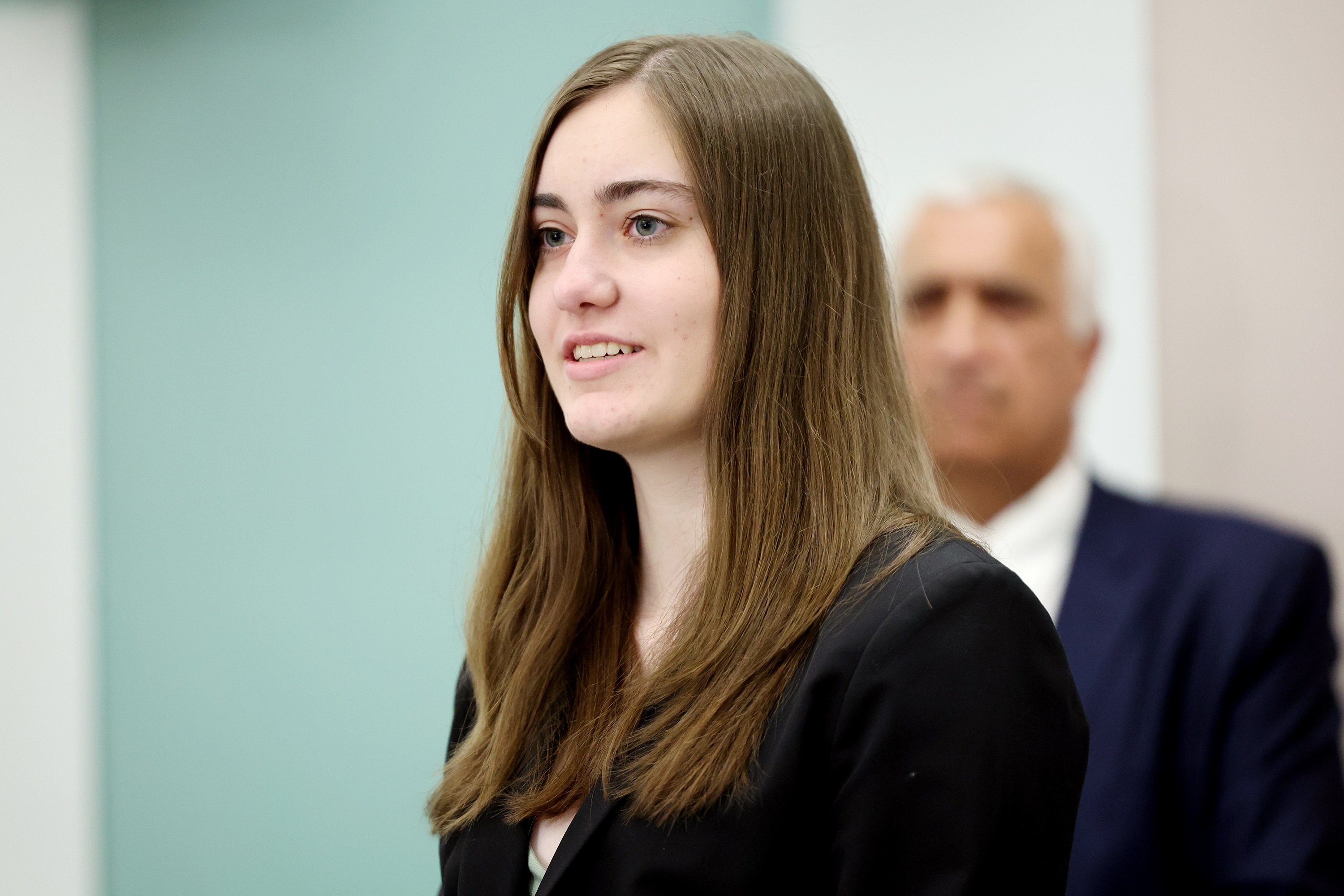 Ella, who has benefited from the services provided by the Children Justice Center, speaks with police and prosecutors and child abuse prevention advocates about National Child Abuse Prevention Month Monday in Salt Lake City.