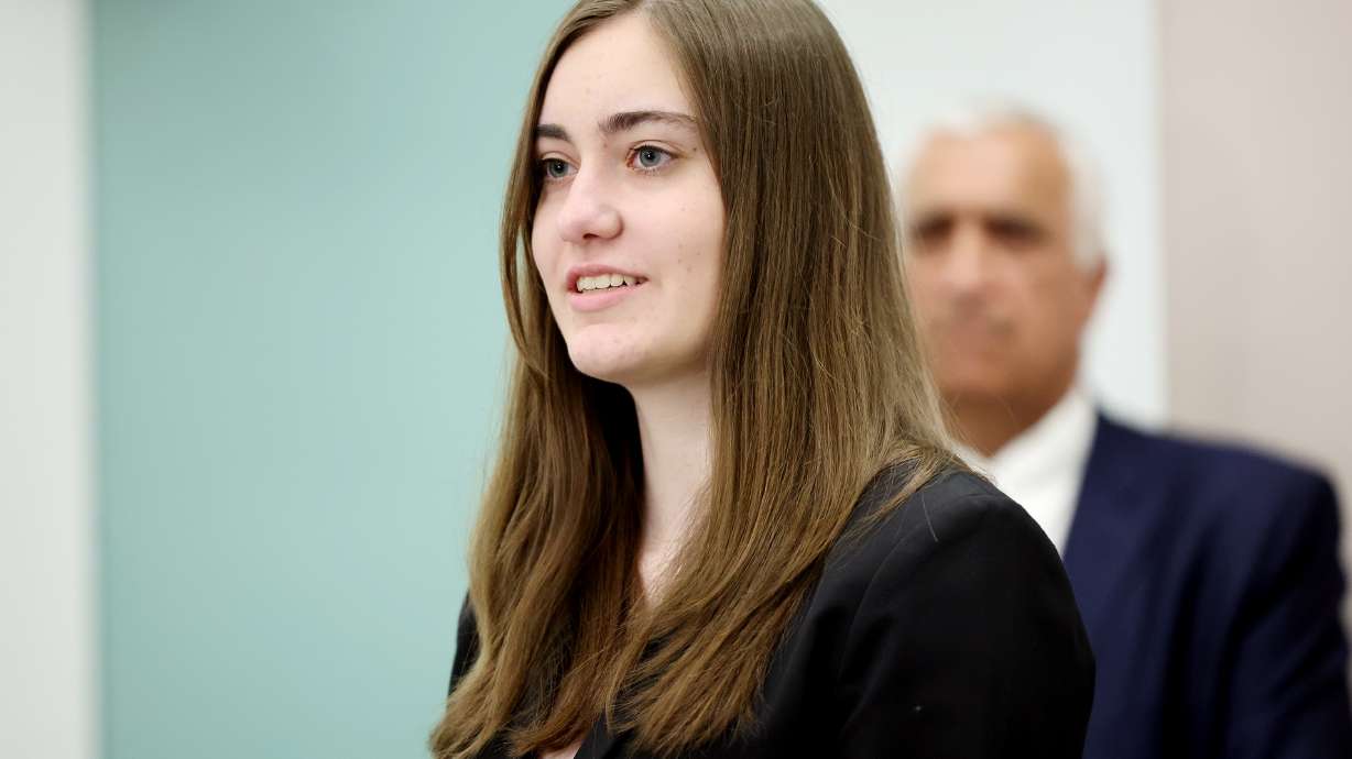 Ella, who has benefited from the services provided by the Children Justice Center, speaks with police and prosecutors and child abuse prevention advocates about National Child Abuse Prevention Month Monday in Salt Lake City.