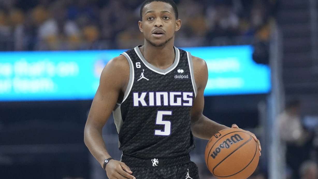 Sacramento Kings guard De'Aaron Fox (5) brings the ball upcourt against the Golden State Warriors during the first half of Game 4 in the first round of the NBA basketball playoffs in San Francisco, Sunday, April 23, 2023.
