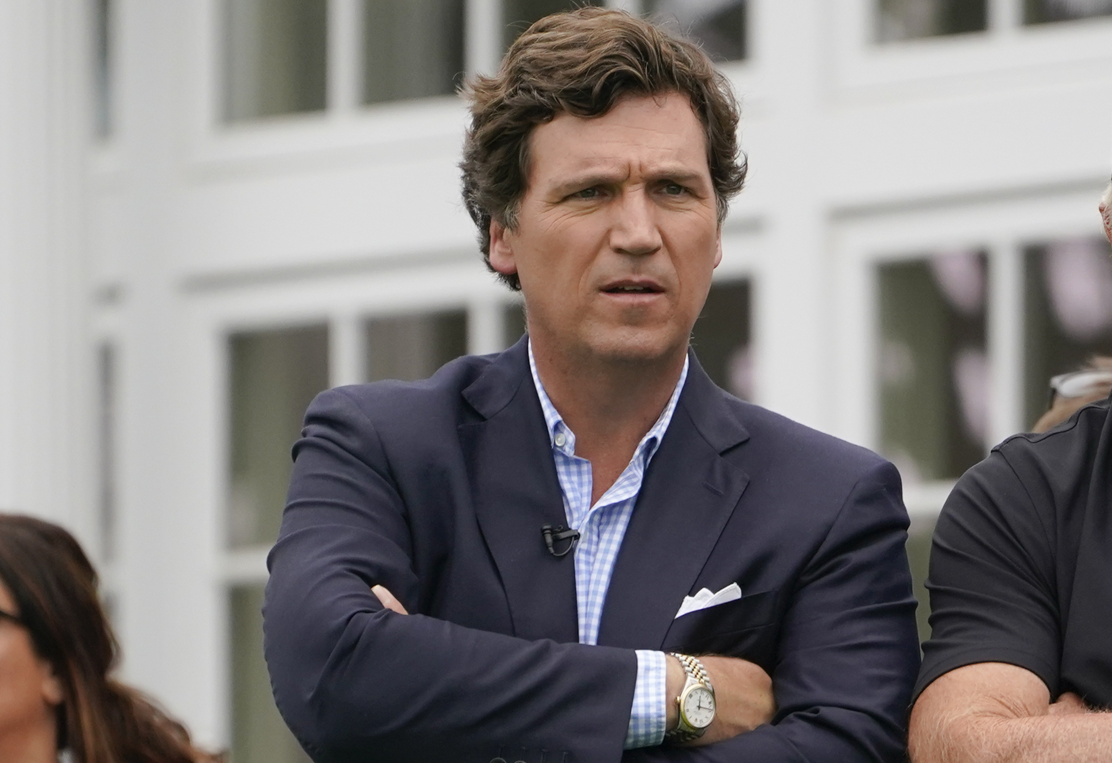 Tucker Carlson at the Bedminster Invitational LIV Golf tournament in Bedminster, N.J., July 31, 2022. Fox News says it has agreed to part ways with Carlson, less than a week after settling a lawsuit over the network’s 2020 election reporting.