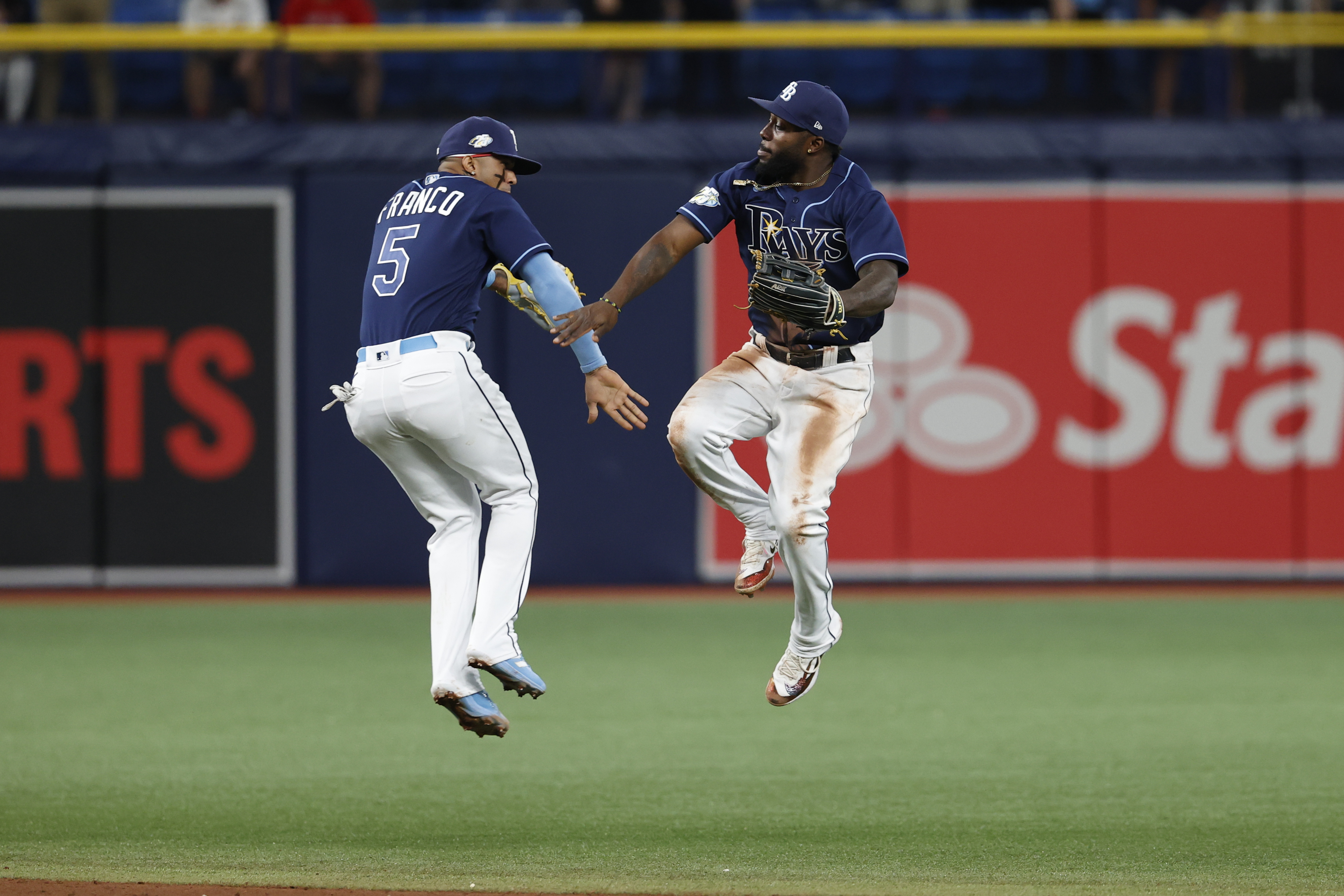 Tampa Bay Rays' Wander Franco, left, and Randy Arozarena celebrate after the Rays defeated the Boston Red Sox in a baseball game Tuesday, April 11, 2023, in St. Petersburg, Fla. 