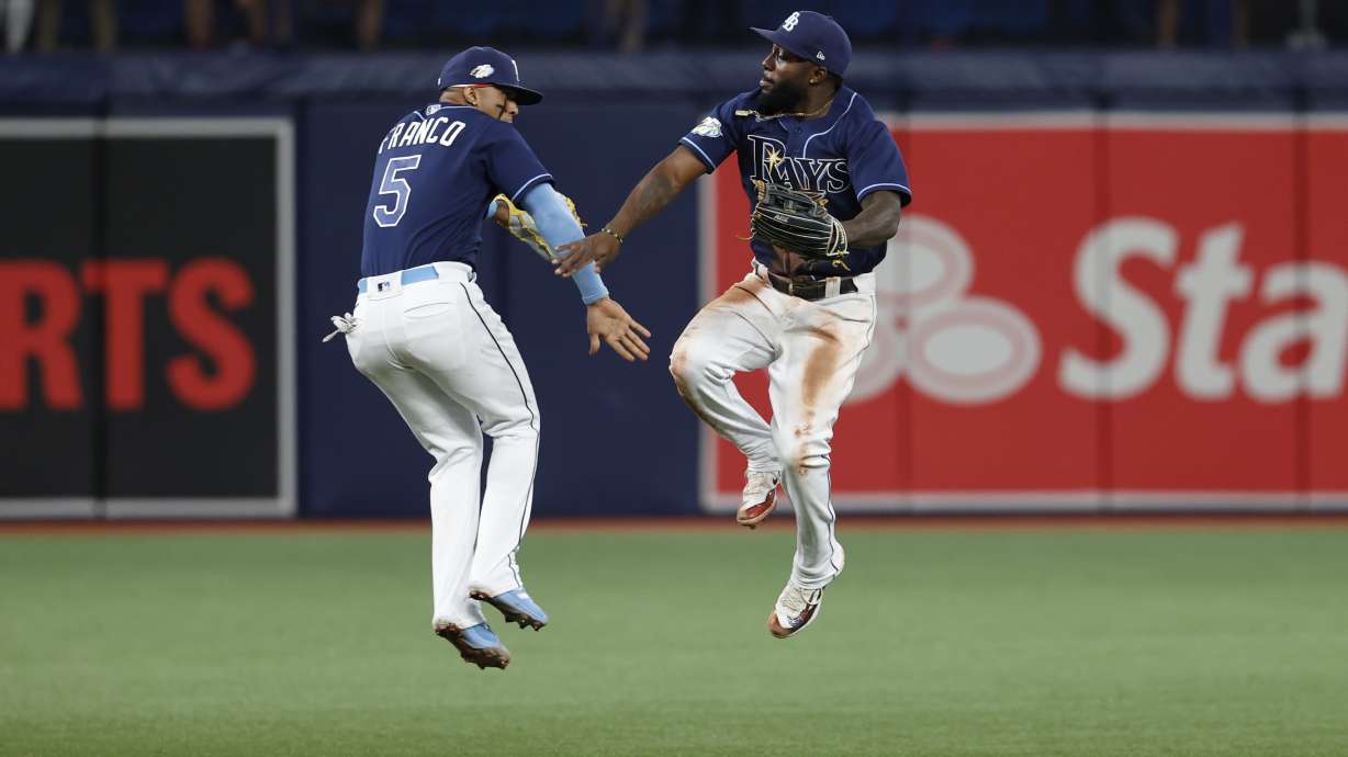 Tampa Bay Rays' Wander Franco, left, and Randy Arozarena celebrate after the Rays defeated the Boston Red Sox in a baseball game Tuesday, April 11, 2023, in St. Petersburg, Fla.