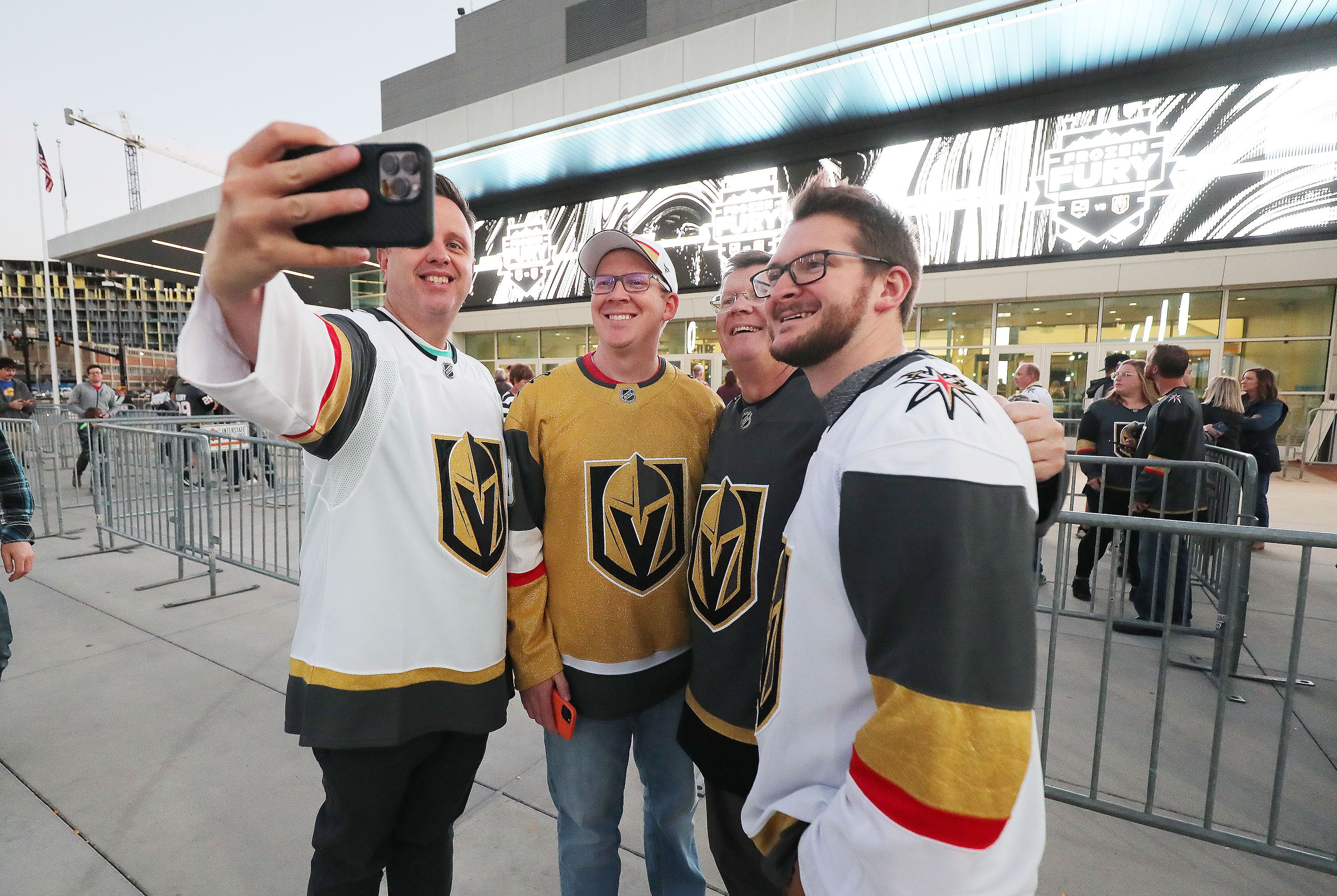 Fans take a photo prior to an NHL exhibition game at Vivint Arena in Salt Lake City on Sept. 30, 2021.