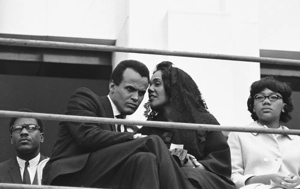 Singer and Civil Rights activist Harry Belefonte listens to Coretta Scott King, widow of the slain civil rights leader, in Memphis, Tennessee on April 8, 1968. Belafonte died Tuesday of congestive heart failure at his New York home. He was 96.