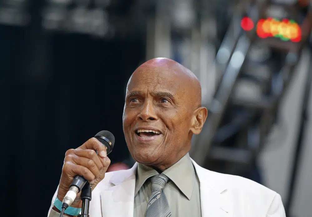 Singer and activist Harry Belafonte speaks during a memorial tribute concert for folk icon and civil rights activist Pete Seeger in New York on July 20, 2014. Belafonte died Tuesday of congestive heart failure at his New York home. He was 96.