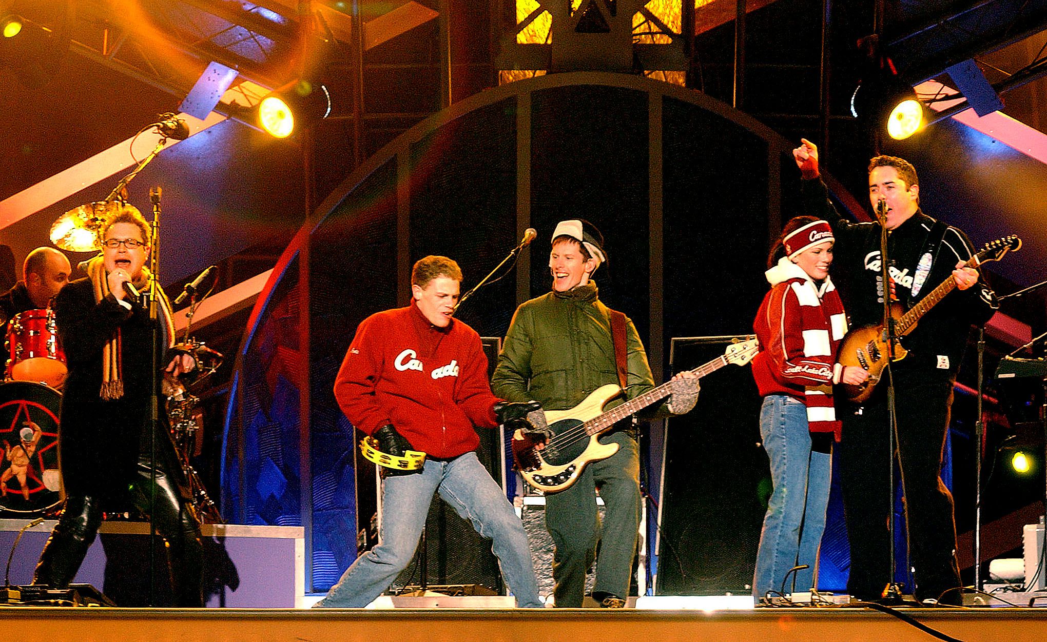 Canadian ice skaters David Pelletier and Jamie Sale perform with Bare Naked Ladies at the Medals Plaza on February 13, 2002. Sites are still needed for Winter Games medals plaza, big air competitions.