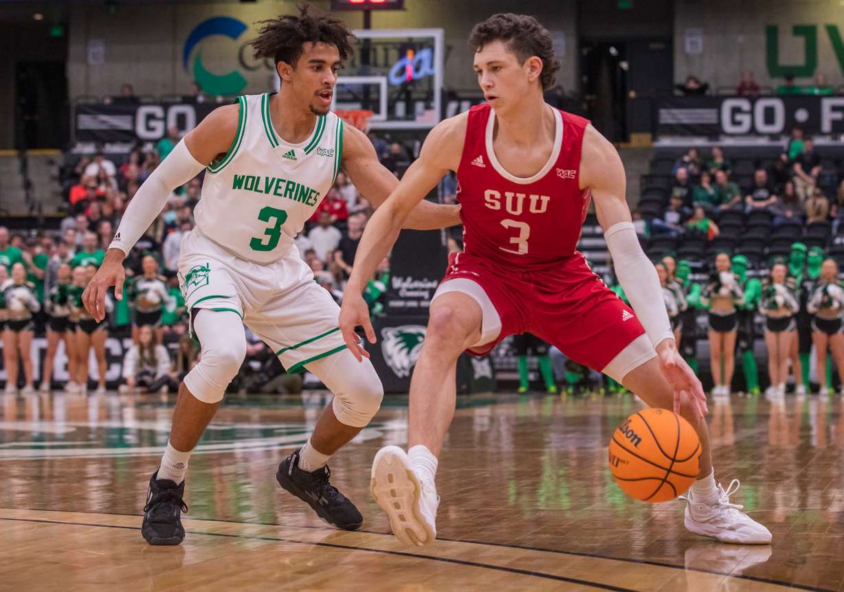 Southern Utah's Drake Allen drives against Utah Valley's Blaze Nield during a Western Athletic Conference basketball game at the UCCU Center in Orem. Allen committed to transfer to UVU on Tuesday.