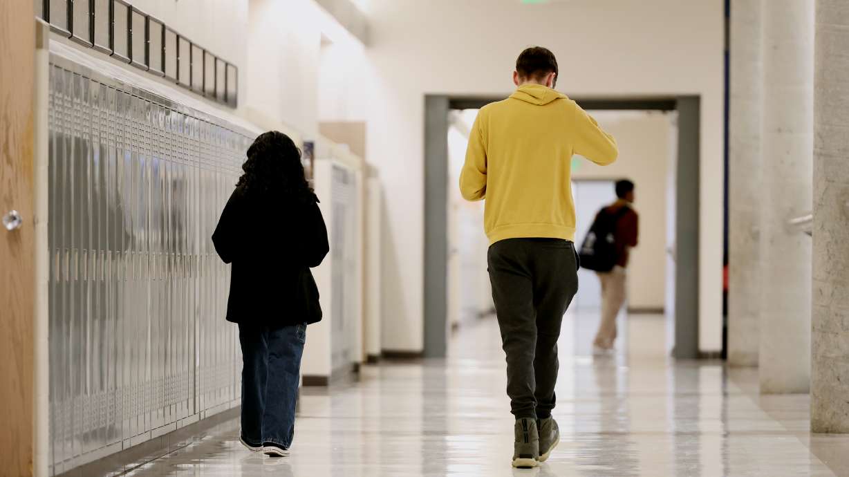 Hunter High School students walk down a hallway on April 4. The Census Bureau released data this month that shows the percentage of Utahns under 18 continues to decrease, matching nationwide trends.
