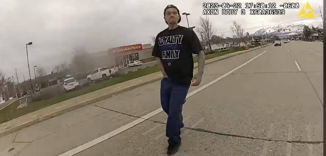 Shawn D Lane Sims, 30, is seen on police body camera video and appears to have his hand in his pocket just before Ogden police tackle and arrest him in Ogden on Saturday.