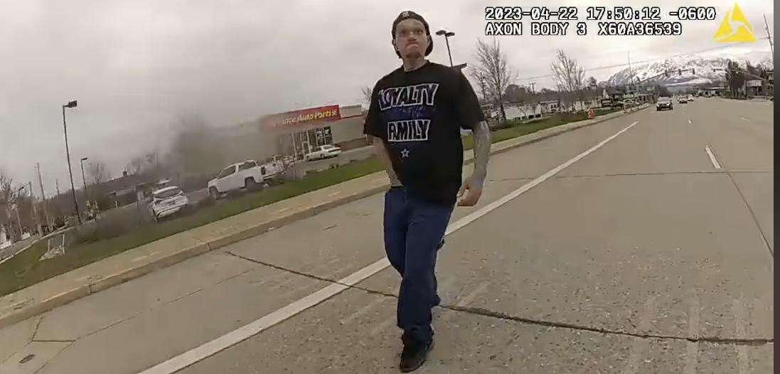 Shawn D Lane Sims, 30, is seen on police body camera video and appears to have his hand in his pocket just before Ogden police tackle and arrest him in Ogden on Saturday.