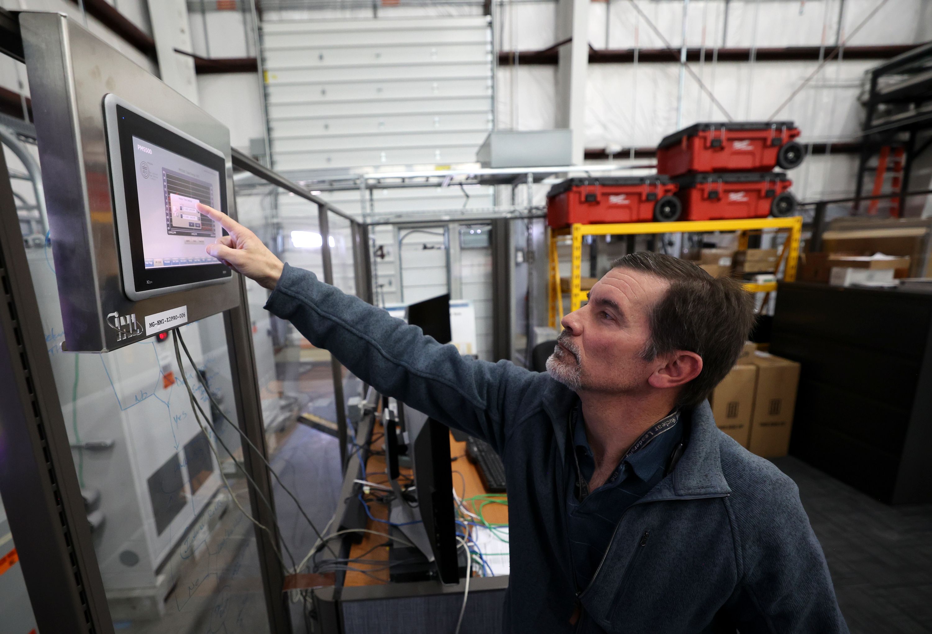 Kurt Myers, Idaho National Laboratory distributed energy and grid systems integration group lead, works in the Microgrid Research Laboratory in the INL Energy Systems Laboratory in Idaho Falls, Idaho, on April 5.