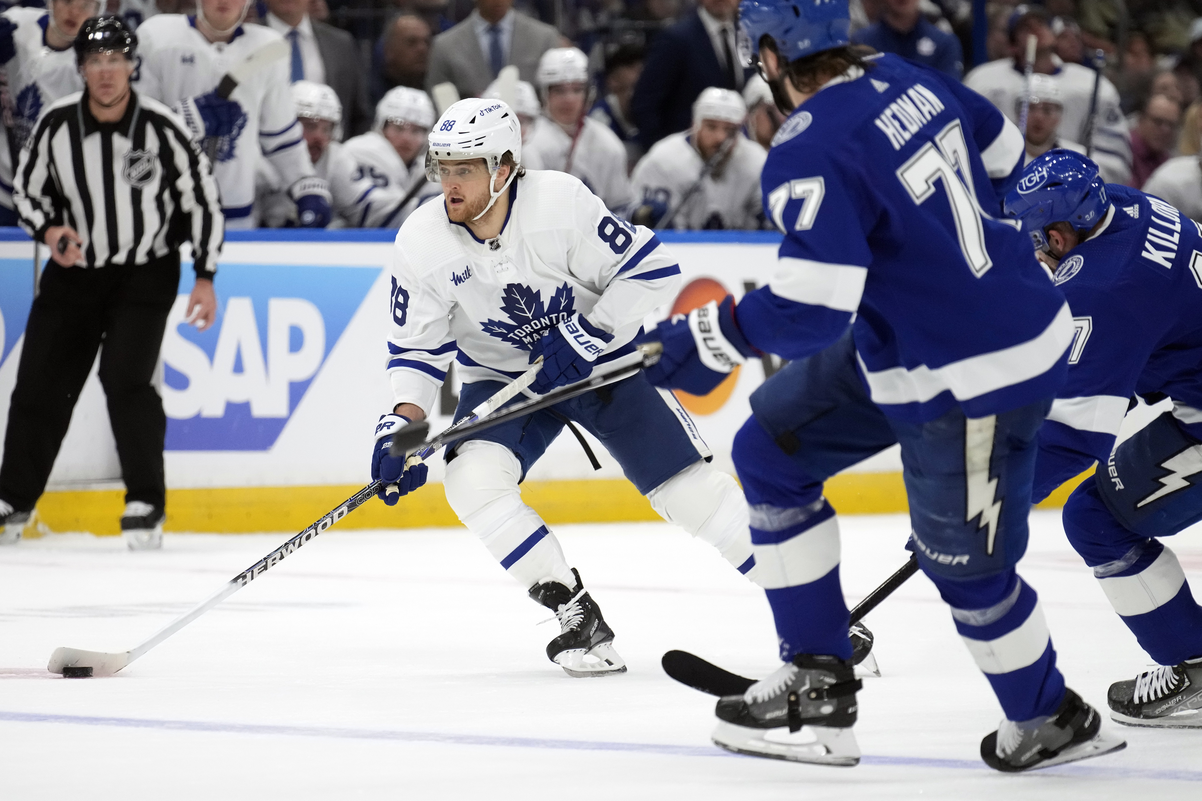 Toronto Maple Leafs right wing William Nylander (88) carries the puck around Tampa Bay Lightning defenseman Victor Hedman (77) and left wing Alex Killorn (17) during the first period in Game 4 of an NHL hockey Stanley Cup first-round playoff series Monday, April 24, 2023, in Tampa, Fla. 