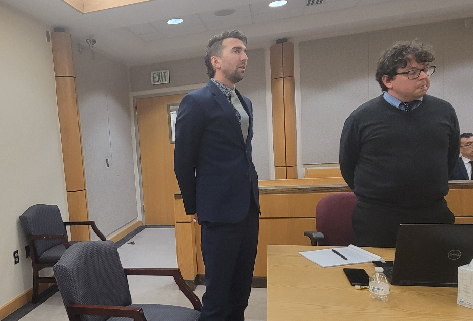 Curtis Vollmar, left, and Jeremy Beckham stand as the guilty verdict is read in Vollmar’s trespassing and disorderly conduct trial at the Beaver County Justice Court on Tuesday.