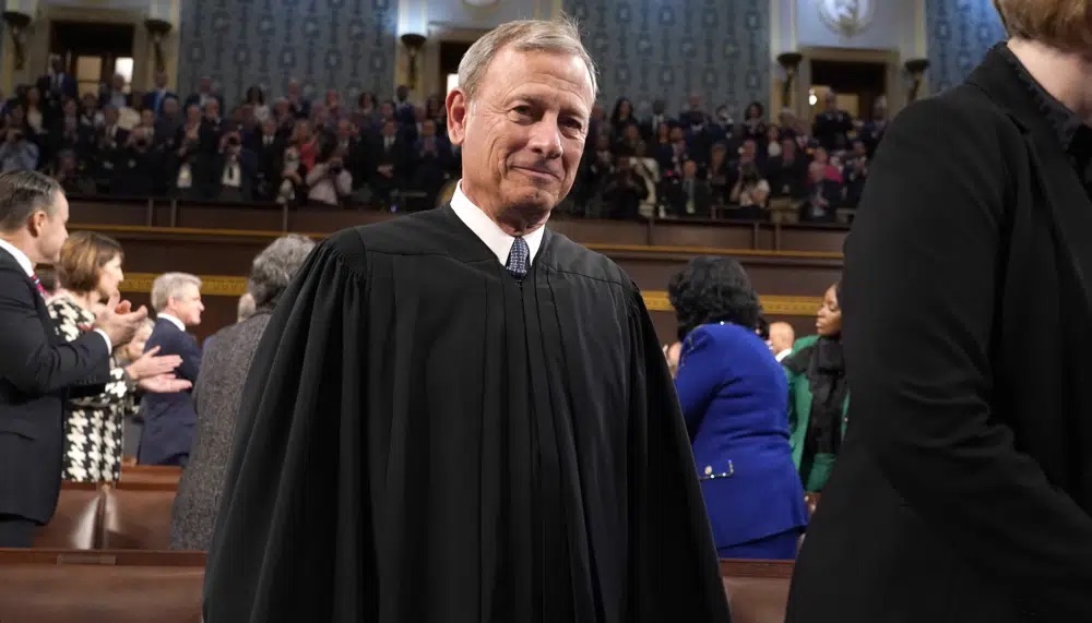 Chief Justice of the United States John Roberts arrives at the Capitol Feb. 7 in Washington. The Democratic chairman of the Senate Judiciary has invited Roberts to testify next month at a hearing on ethics standards. 