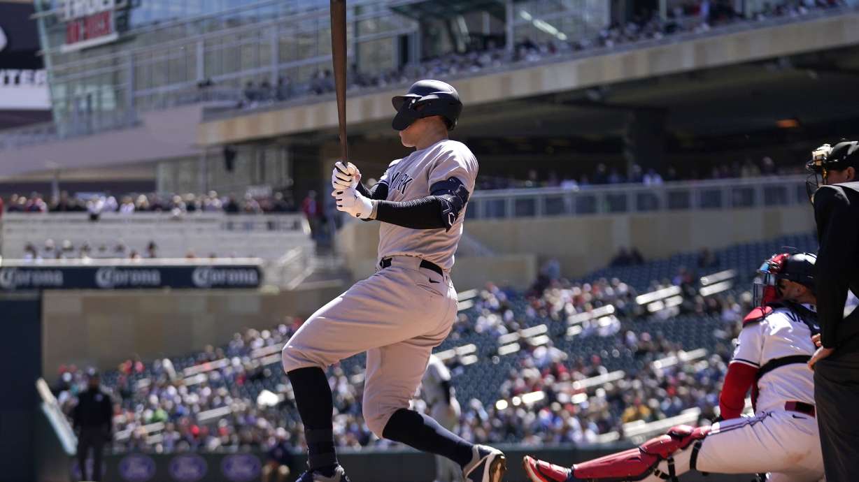 New York Yankees' Aaron Judge hits a three-run double during the second inning of a baseball game against the Minnesota Twins, Wednesday, April 26, 2023, in Minneapolis.