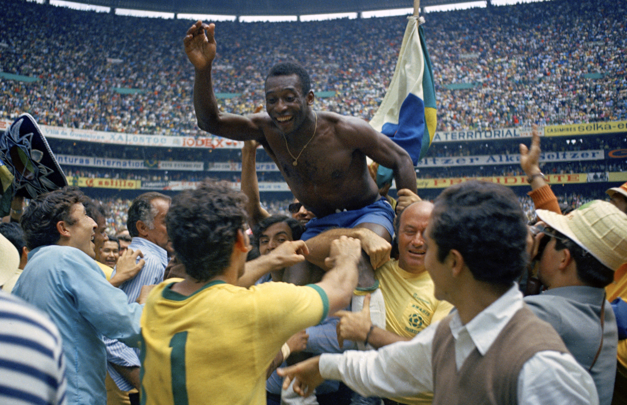 FILE - Brazil's Pele is hoisted on the shoulders of his teammates after Brazil won the World Cup final against Italy, 4-1, in Mexico City's Estadio Azteca, June 21, 1970. A Brazilian dictionary has added “Pelé” as an adjective to use when describing someone who is “exceptional, incomparable, unique.” The announcement by the Michaelis dictionary on Wednesday, April 26, 2023, is part of a campaign that gathered more than 125,000 signatures to honor the late soccer great’s impact beyond his sport. 
