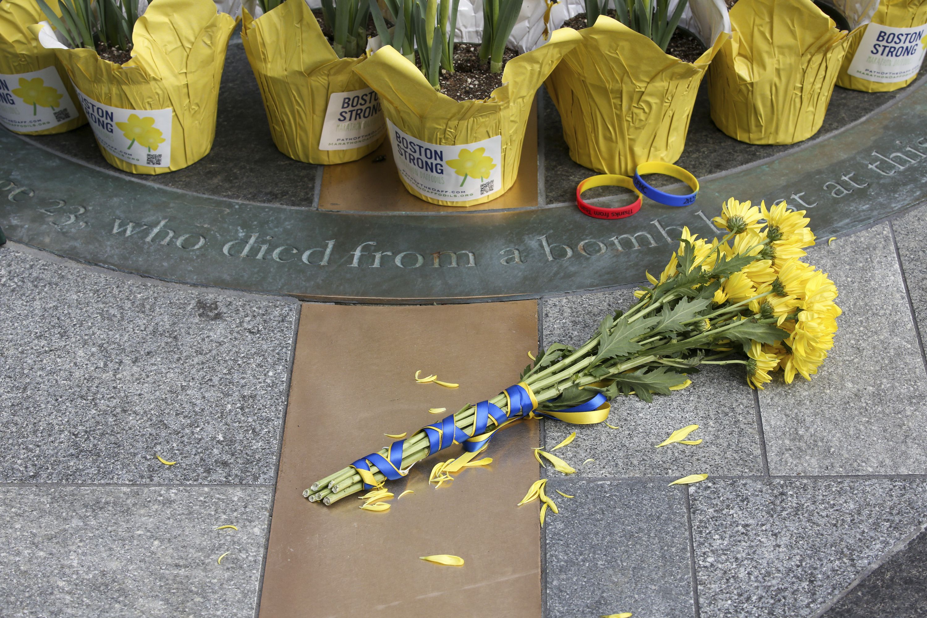 Flowers are placed at a memorial for victims of the 2013 Boston Marathon bombing on the 10th anniversary of the attack April 15 in Boston. A Senate subcommittee is assessing the nation’s preparedness for threats like the 2013 attack.