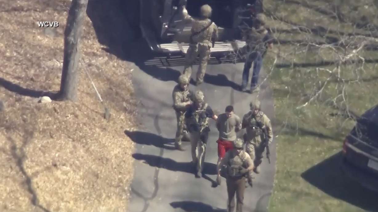 Jack Teixeira is taken into custody on April 13, in Dighton, Mass. A judge is expected to hear arguments Thursday over whether Teixeira, accused of leaking highly classified military documents about the Ukraine war and other issues, should remain in jail while he awaits trial.