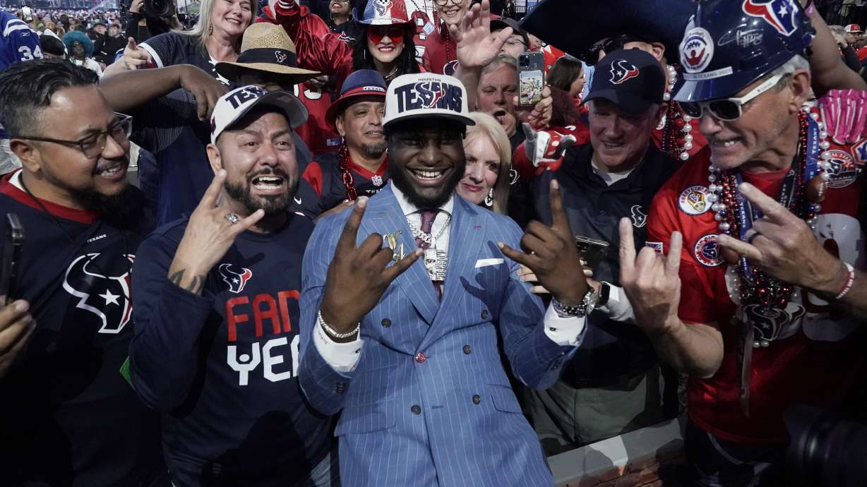 Alabama linebacker Will Anderson Jr. celebrates with fans after being chosen by the Houston Texans with the third overall pick during the first round of the NFL football draft, Thursday, April 27, 2023, in Kansas City, Mo.