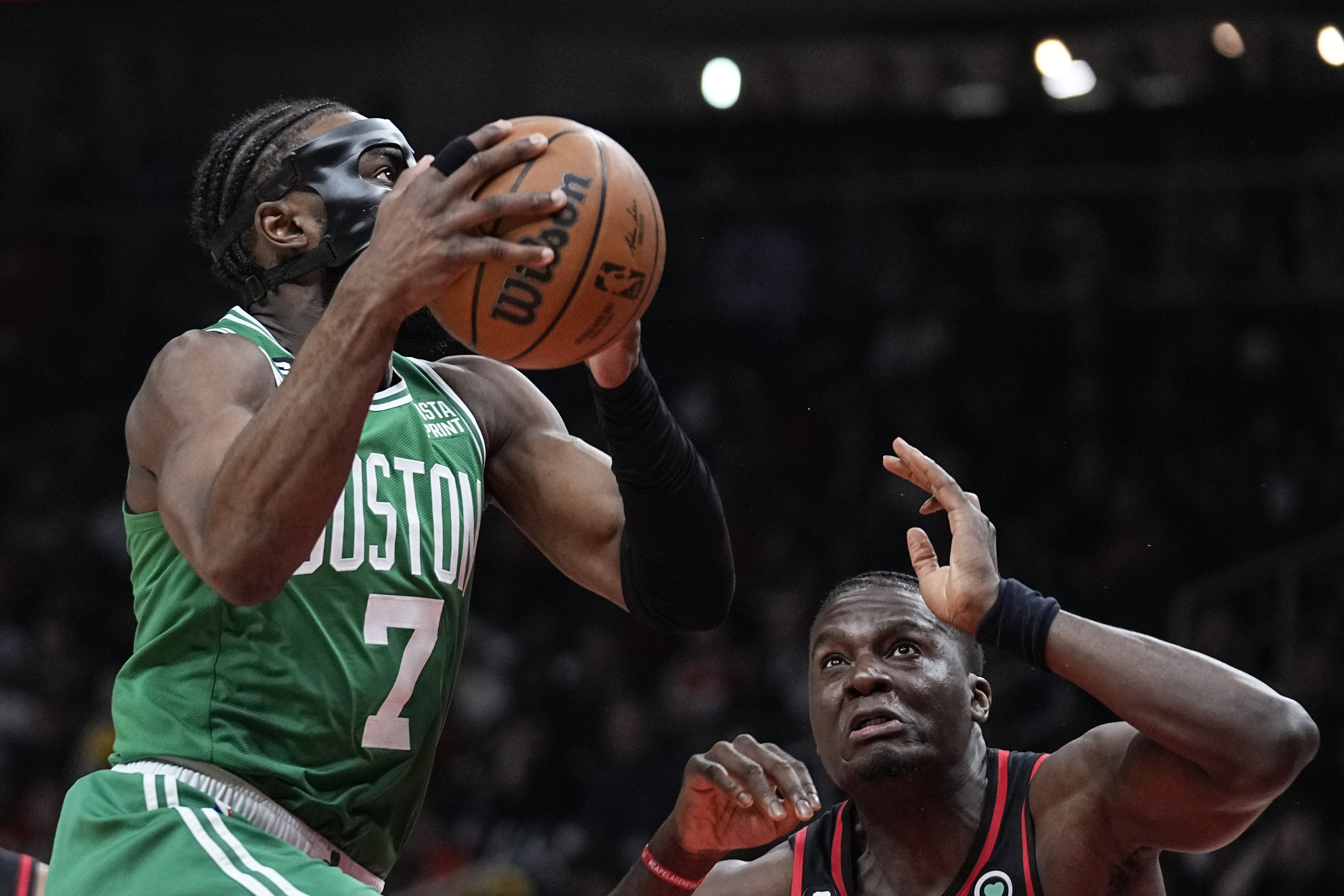 Boston Celtics guard Jaylen Brown (7) looks to score against Atlanta Hawks center Clint Capela (15) during the first half of Game 6 of a first-round NBA basketball playoff series, Thursday, April 27, 2023, in Atlanta. 