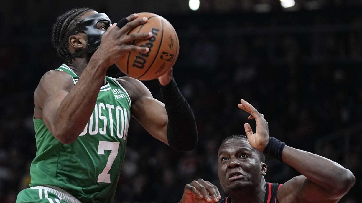 Boston Celtics guard Jaylen Brown (7) looks to score against Atlanta Hawks center Clint Capela (15) during the first half of Game 6 of a first-round NBA basketball playoff series, Thursday, April 27, 2023, in Atlanta.
