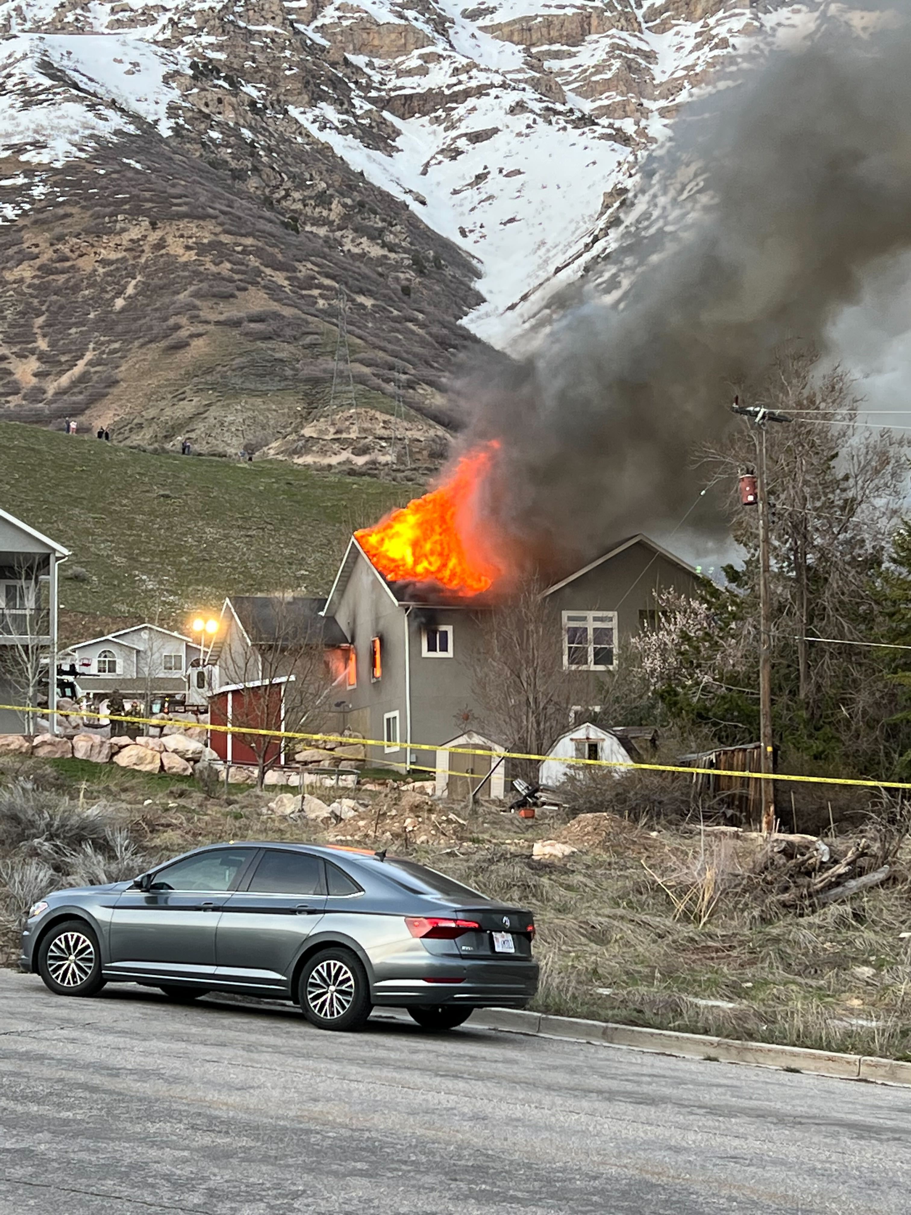 A house erupted into flames during a shooting in North Ogden on April 27. The man found dead in the house following the fire and shootout between police and the man's estranged brother is being remembered as a hero.