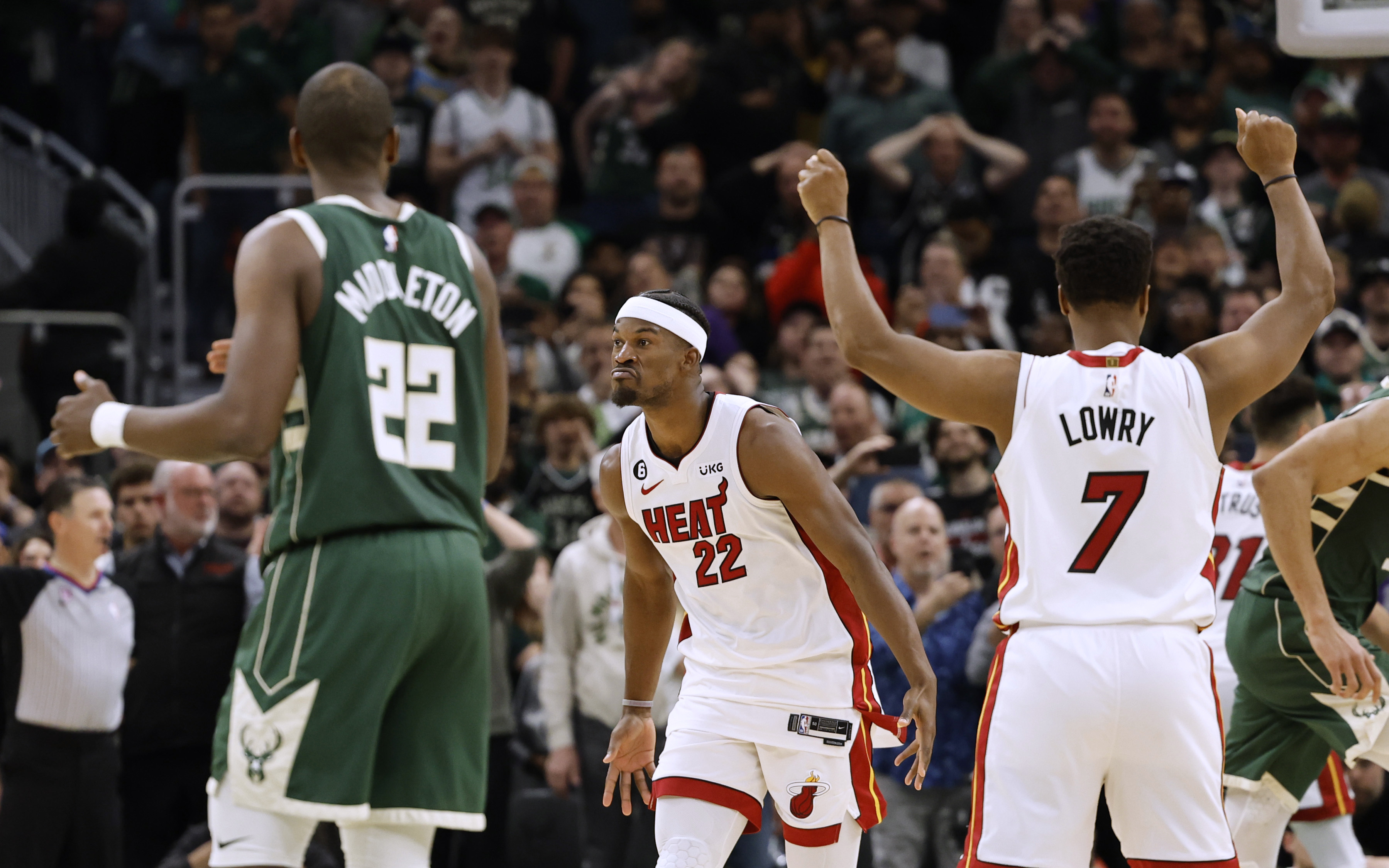 Miami Heat forward Jimmy Butler (22) celebrates his basket against the Milwaukees Bucks during the final second of the second half of Game 5 in a first-round NBA basketball playoff series Wednesday, April 26, 2023, in Milwaukee. The Heat won 128-126 in overtime, eliminating the Bucks from the playoffs. 