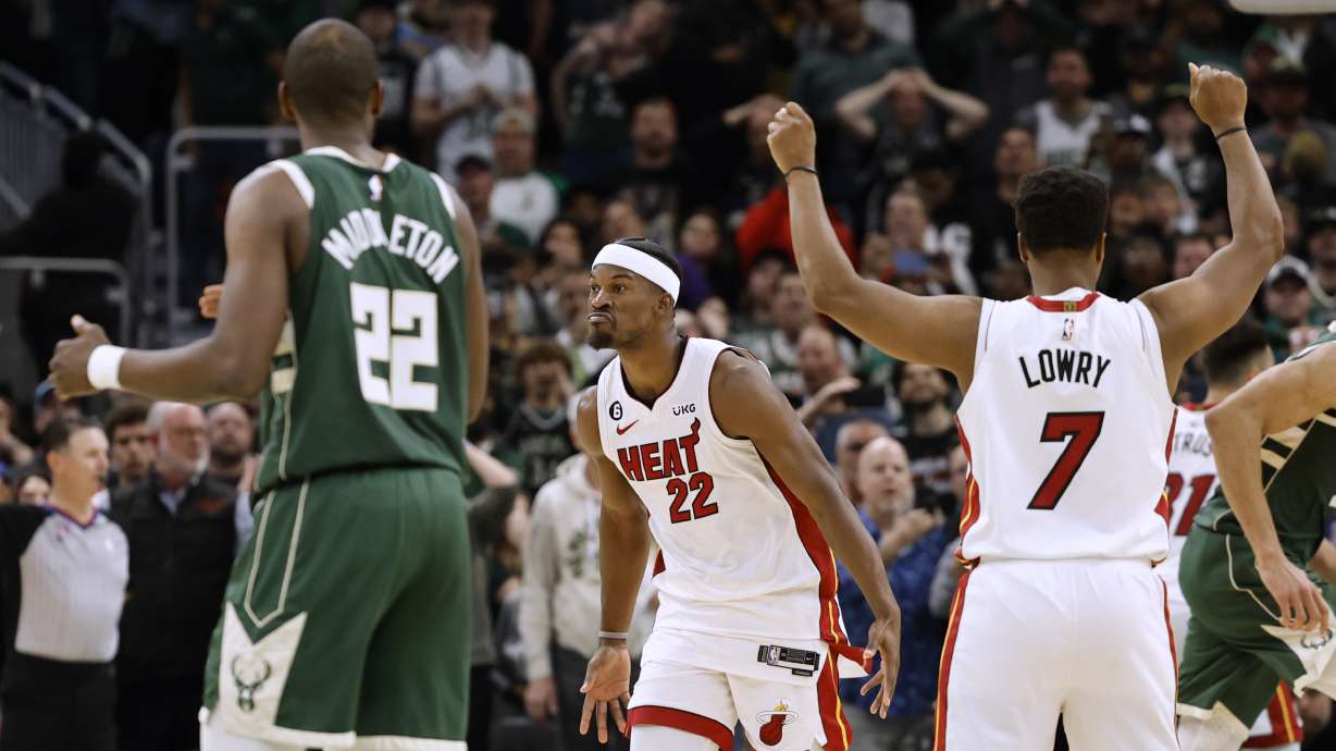 Miami Heat forward Jimmy Butler (22) celebrates his basket against the Milwaukees Bucks during the final second of the second half of Game 5 in a first-round NBA basketball playoff series Wednesday, April 26, 2023, in Milwaukee. The Heat won 128-126 in overtime, eliminating the Bucks from the playoffs.