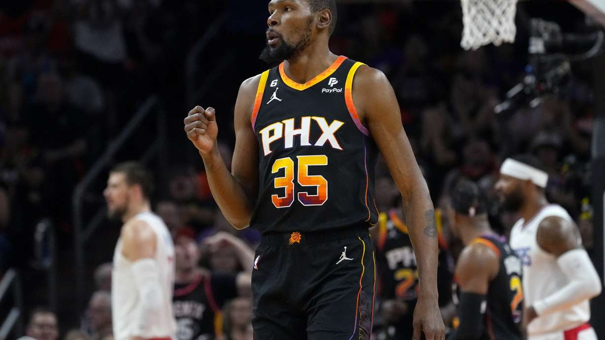 Phoenix Suns forward Kevin Durant (35) celebrates a basket against the Los Angeles Clippers during Game 5 of a first-round NBA basketball playoff series, Tuesday, April 25, 2023, in Phoenix.