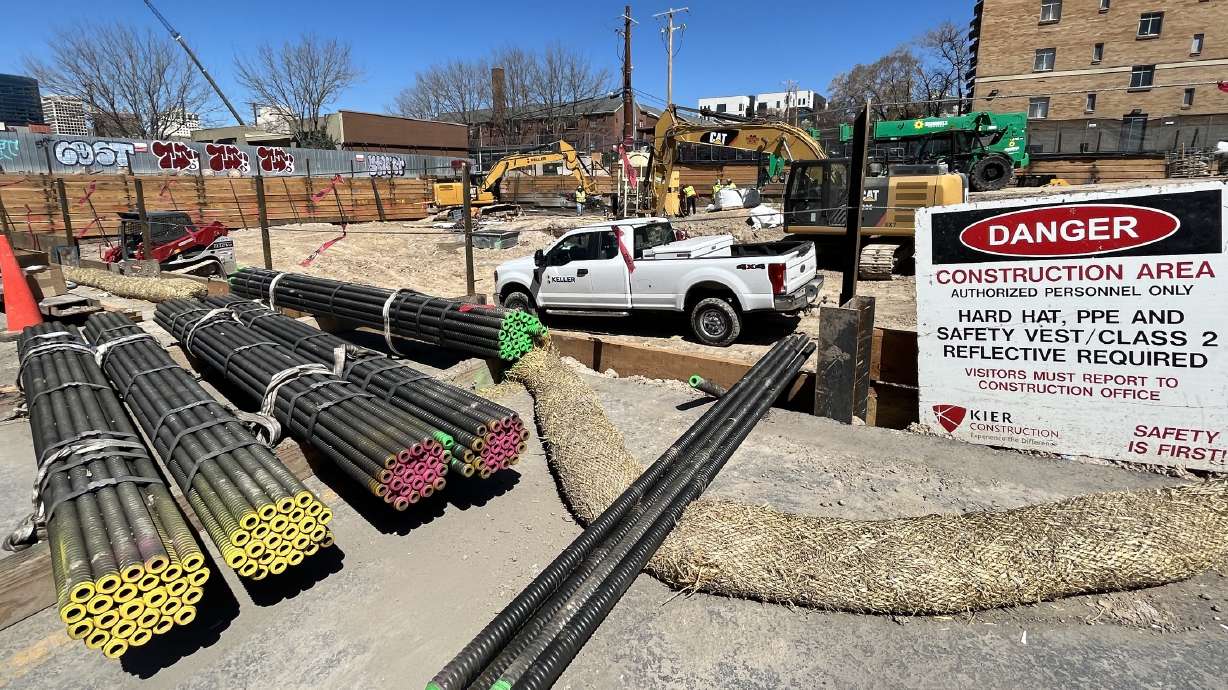 Construction equipment is placed on a parking lot next to where the 144 South Project will be constructed Friday morning. The development is slated provide 110 affordable housing units by the time the project is completed in the near future.