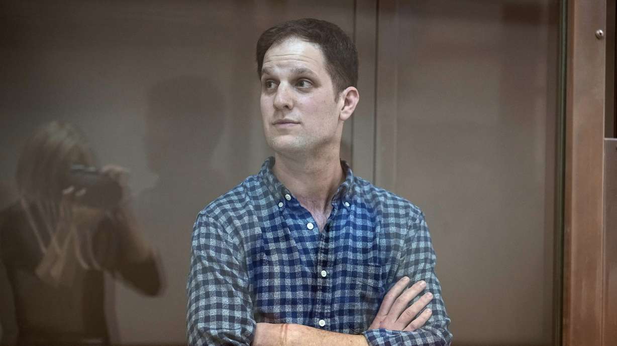 Wall Street Journal reporter Evan Gershkovich stands in a glass cage in a courtroom at the Moscow City Court, in Moscow, Russia, April 18. Despite its reputation as a comedic roast, the White House Correspondents' Association dinner on Saturday plans to take on the serious and solemn role of journalism in a democracy. This year’s dinner occurs as Gershkovich has been imprisoned in Russia.