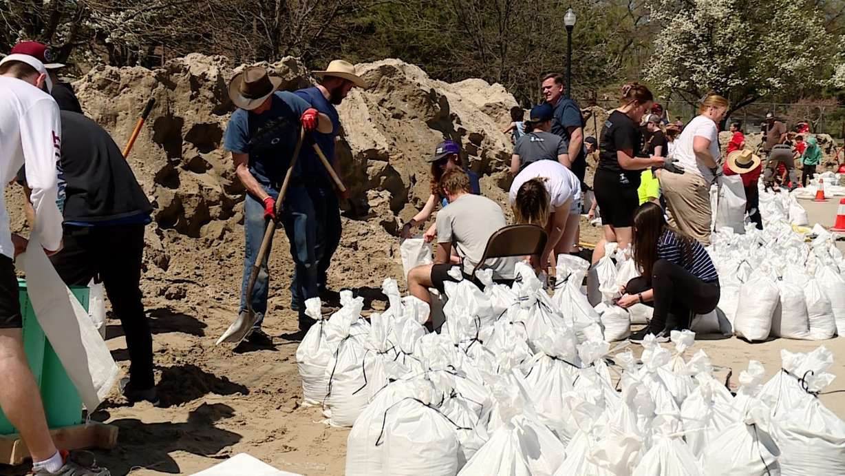 Volunteers at Murray Park helping to fill sandbags in Murray on Saturday.