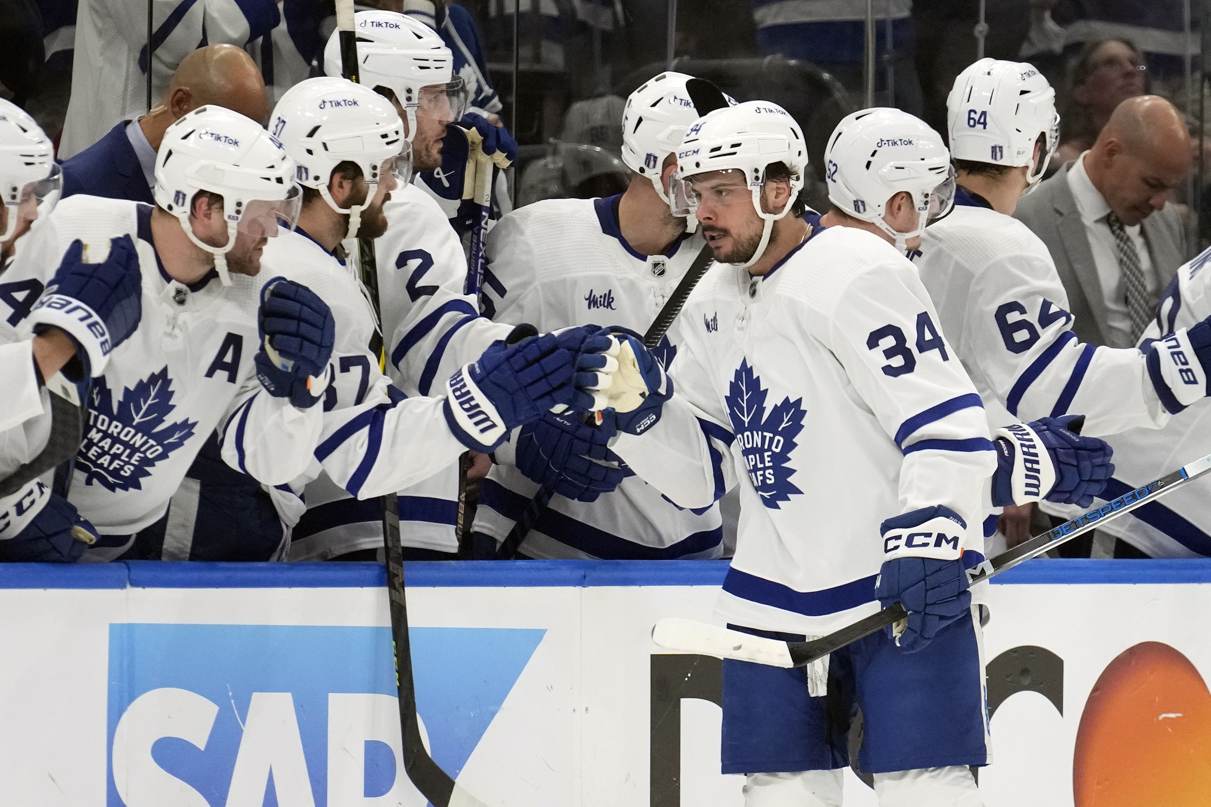 Toronto Maple Leafs center Auston Matthews (34) celebrates with the bench after his goal against the Tampa Bay Lightning during the second period in Game 6 of an NHL hockey Stanley Cup first-round playoff series Saturday, April 29, 2023, in Tampa, Fla. 