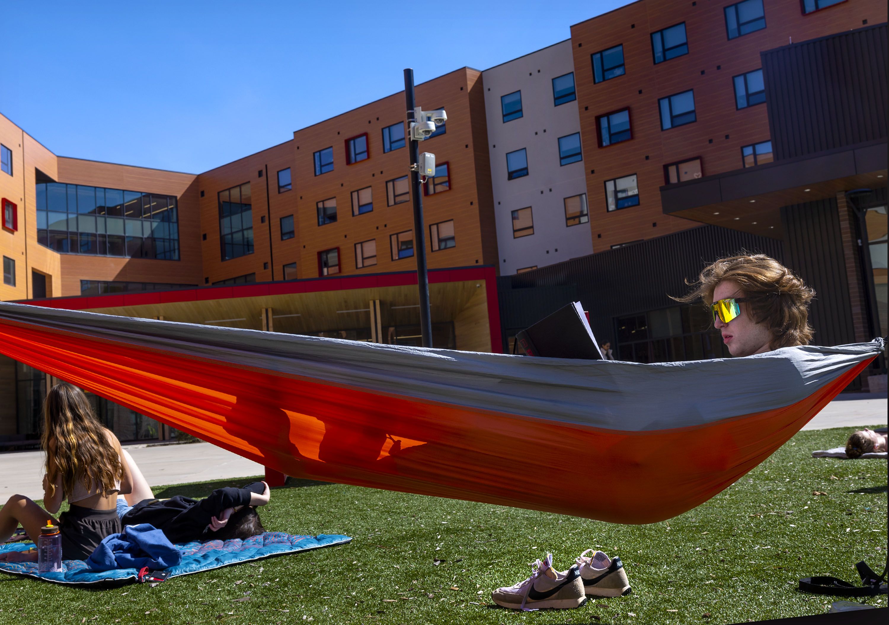 First-year student Kieran Griffin reads in the courtyard of Kahlert Village at the University of Utah in Salt Lake City on April 26. The University of Utah’s giving campaign raised $3 billion, far exceeding what was designed as an eight-year, $2 billion campaign.