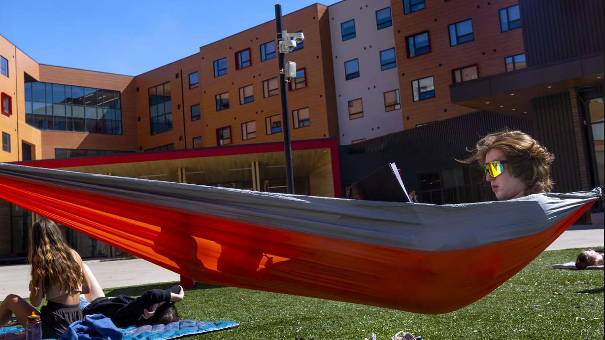 First-year student Kieran Griffin reads in the courtyard of Kahlert Village at the University of Utah in Salt Lake City on April 26. The University of Utah’s giving campaign raised $3 billion, far exceeding what was designed as an eight-year, $2 billion campaign.
