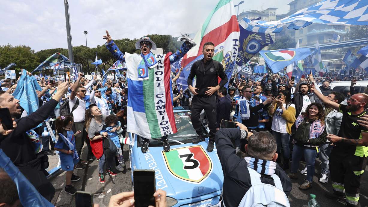 Napoli fans celebrate ahead of a Serie A soccer match between Napoli and Salernitana, in Naples, Italy, Sunday, April 30, 2023. Napoli could end a wait of more than three decades for the Serie A title. Napoli will know the permutations before its match against Salernitana. If second-placed Lazio fails to win at Inter Milan earlier in the day, then a Napoli win will clinch the scudetto.
