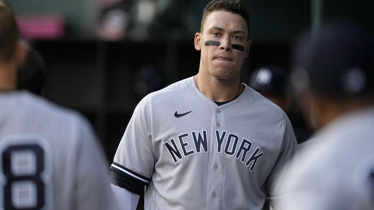 New York Yankees' Aaron Judge walks through the dugout during the first inning of the team's baseball game against the Texas Rangers, Thursday, April 27, 2023, in Arlington, Texas.