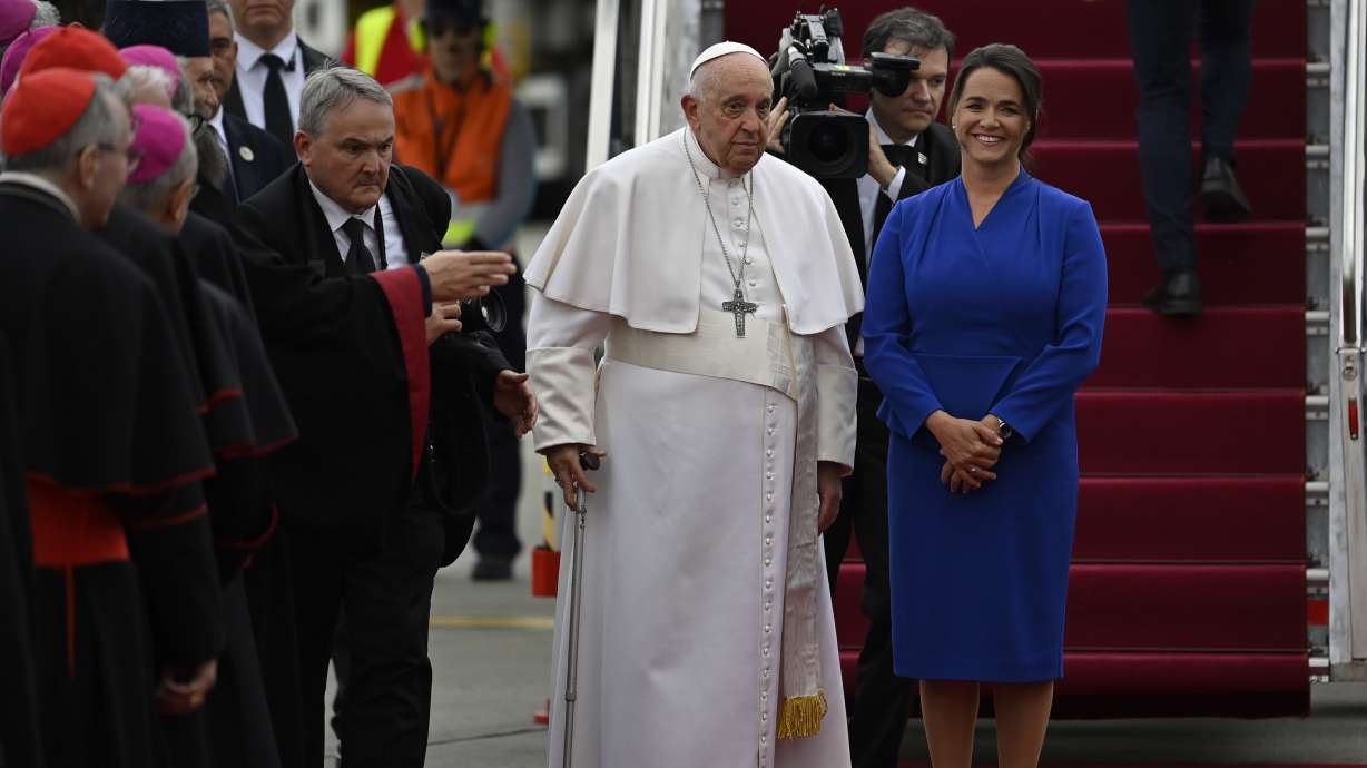 Pope Francis is greeted by Hungary President Katalin Novak during the farewell ceremony at the Budapest International Airport in Budapest, Hungary, Sunday.