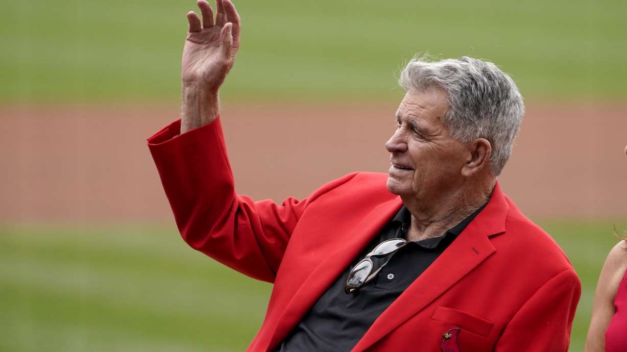 FILE - Mike Shannon waves as he is honored before the start of a baseball game between the St. Louis Cardinals and the Chicago Cubs, Oct. 3, 2021, in St. Louis. Shannon, a two-time World Series winner and longtime St. Louis Cardinals broadcaster, has died. He was 83.