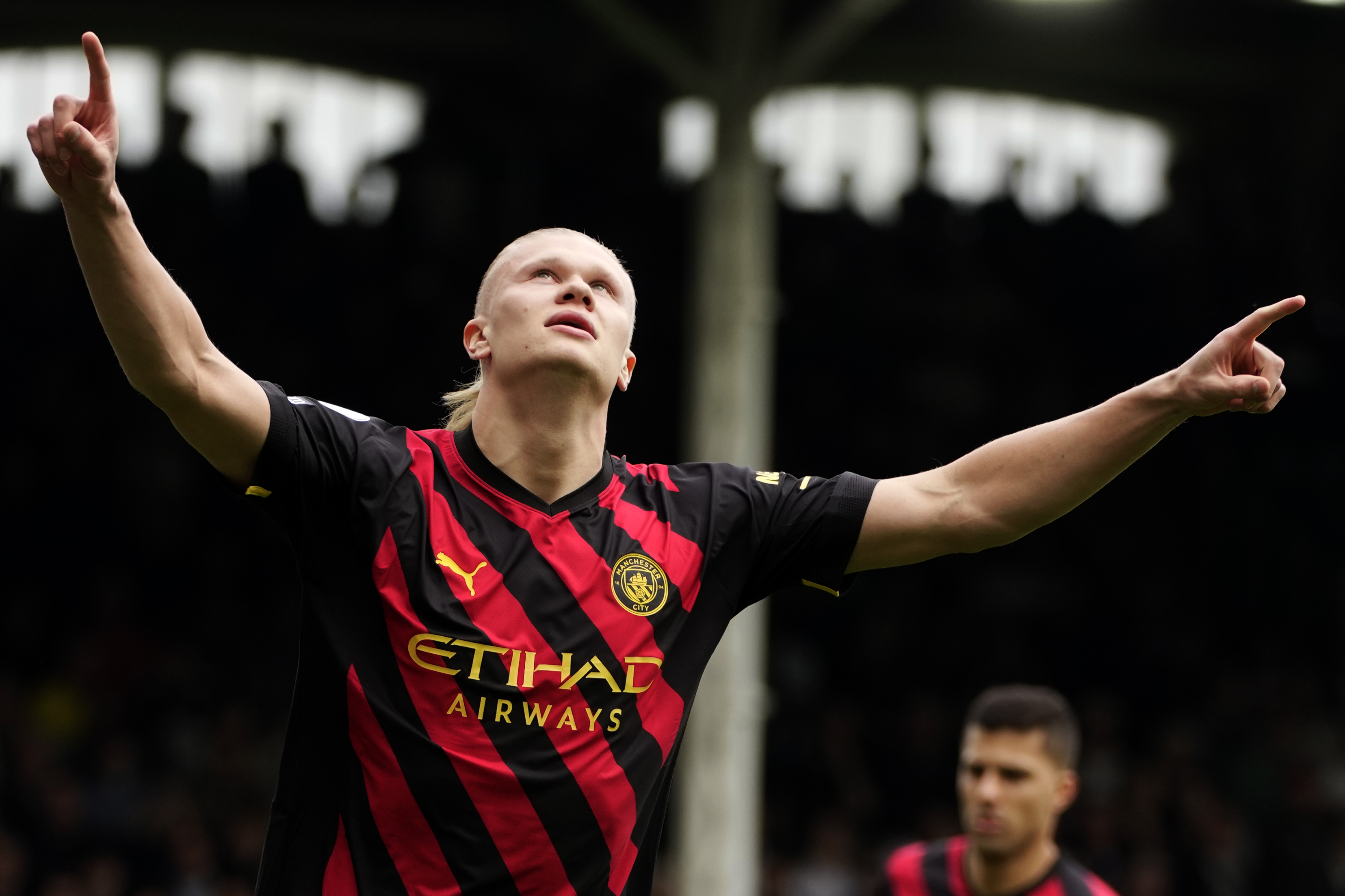 Manchester City's Erling Haaland celebrates after scoring the opening goal during the English Premier League soccer match between Fulham and Manchester City at Craven Cottage in London, Sunday, April 30, 2023. 
