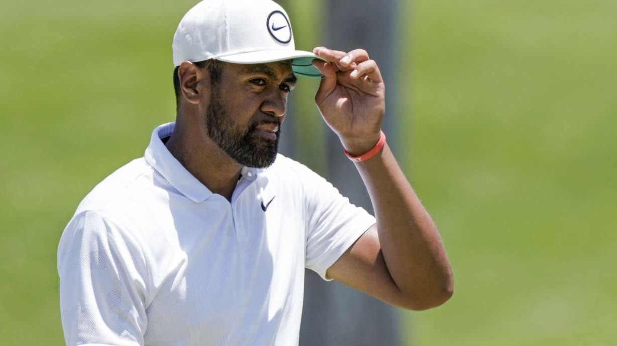 Tony Finau of United States adjusts his cap at the 9th green at the end the second round of the Mexico Open golf tournament in Puerto Vallarta, Mexico, Friday, April 28, 2023.