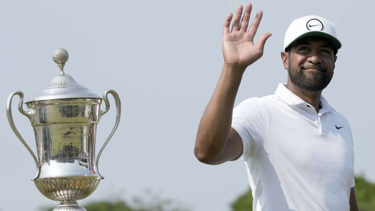 Tony Finau of the United States celebrates his victory in the Mexico Open golf tournament's final round in Puerto Vallarta, Mexico, Sunday, April 30, 2023.