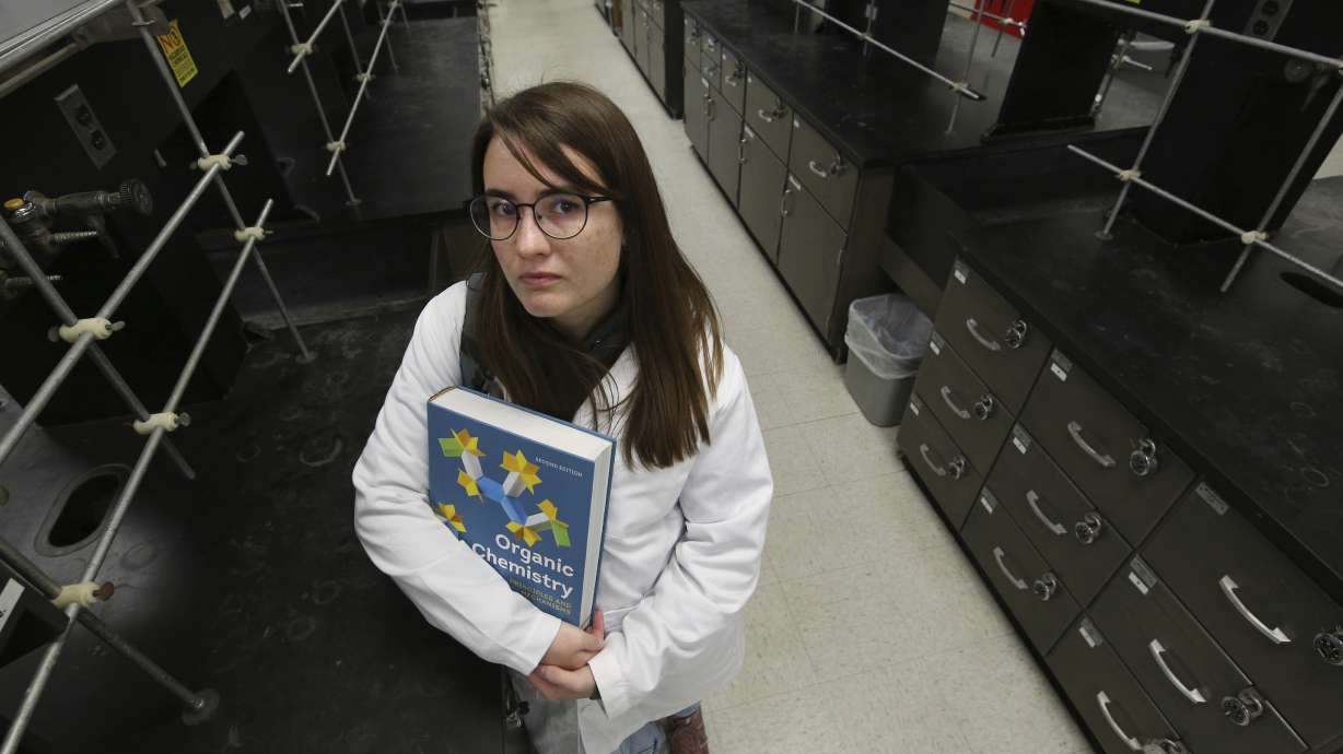 Ricki Korba, 23, stands for a portrait in her lab at California State University, Bakersfield, in Bakersfield, Calif., on April 14. After taking classes at a community college and transferring schools, she learned most of her previous classes wouldn’t count.