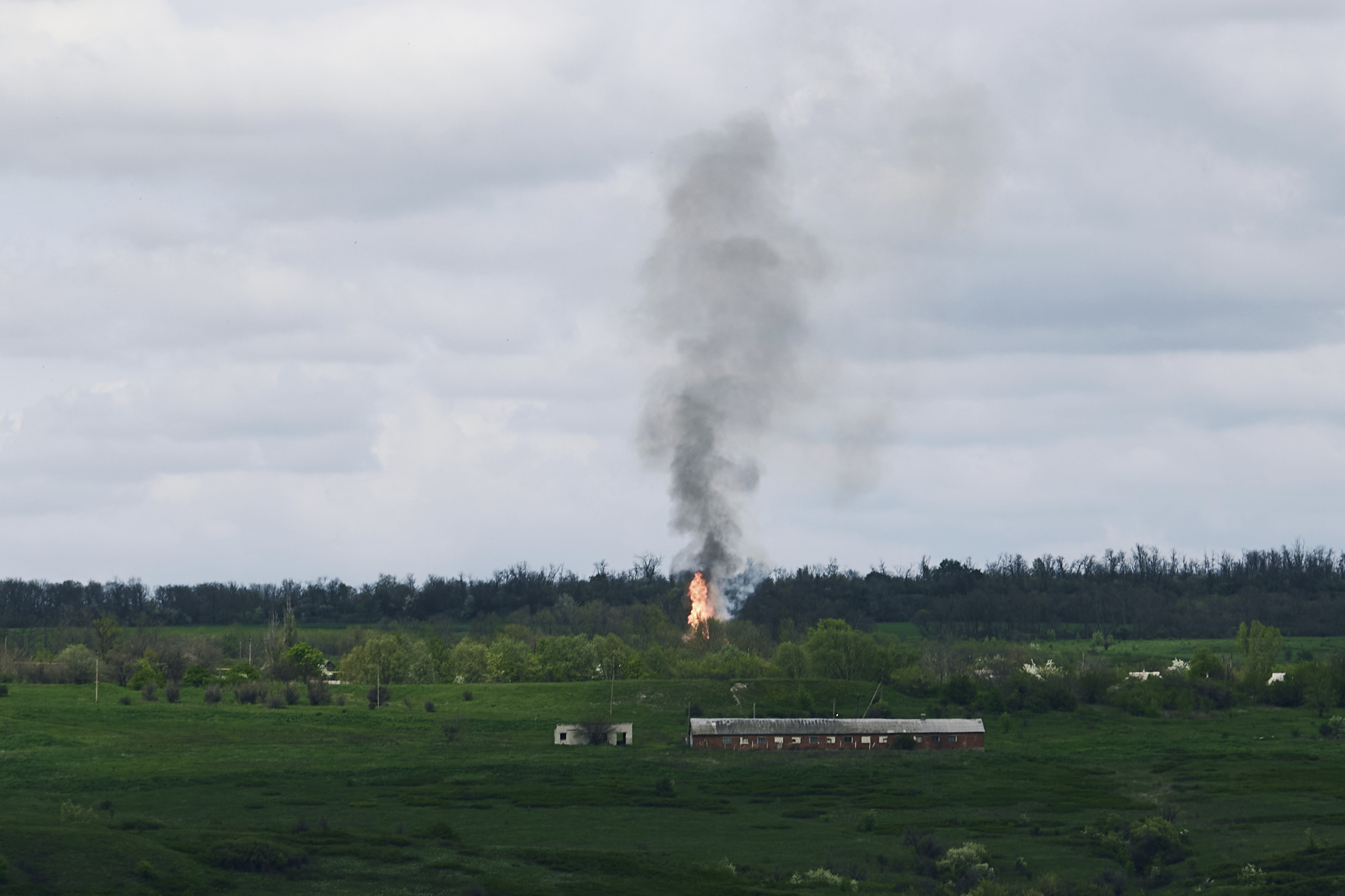 Fire and smoke rise after artillery shelling near Bakhmut, an eastern city where fierce battles between Ukrainian and Russian forces have been taking place, in the Donetsk region, Ukraine, Saturday.