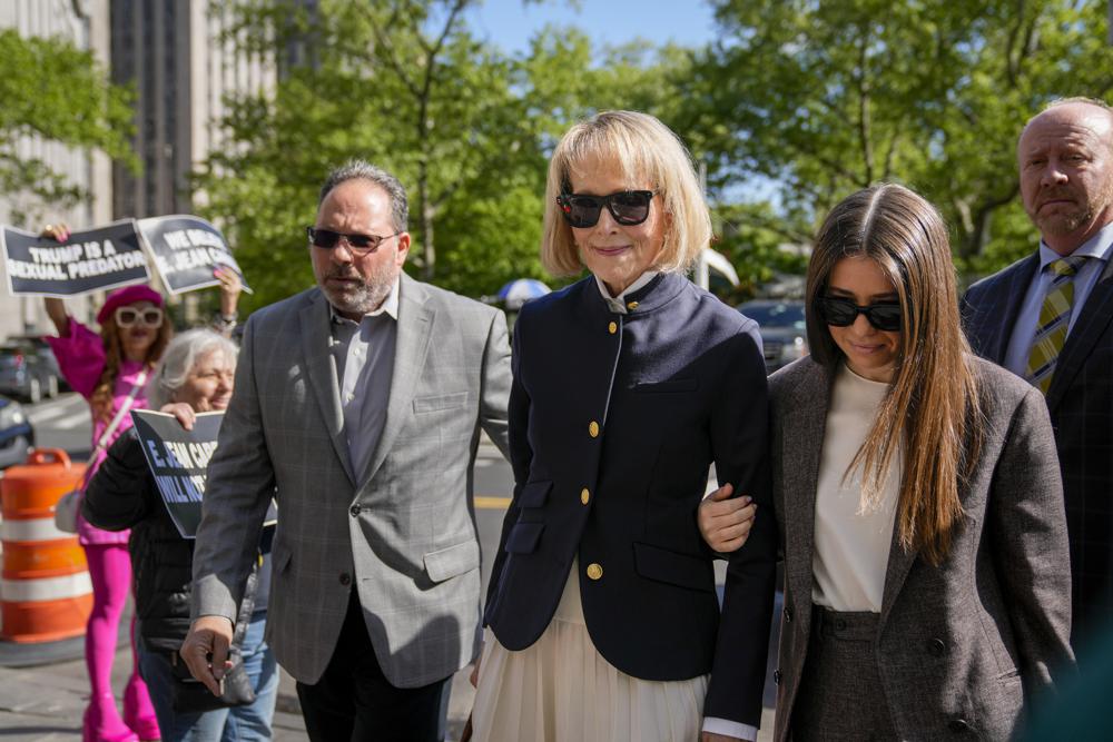 Former advice columnist E. Jean Carroll arrives to Manhattan federal court, Monday in New York. The lawyer for former President Donald Trump wants a mistrial in his client's rape case.