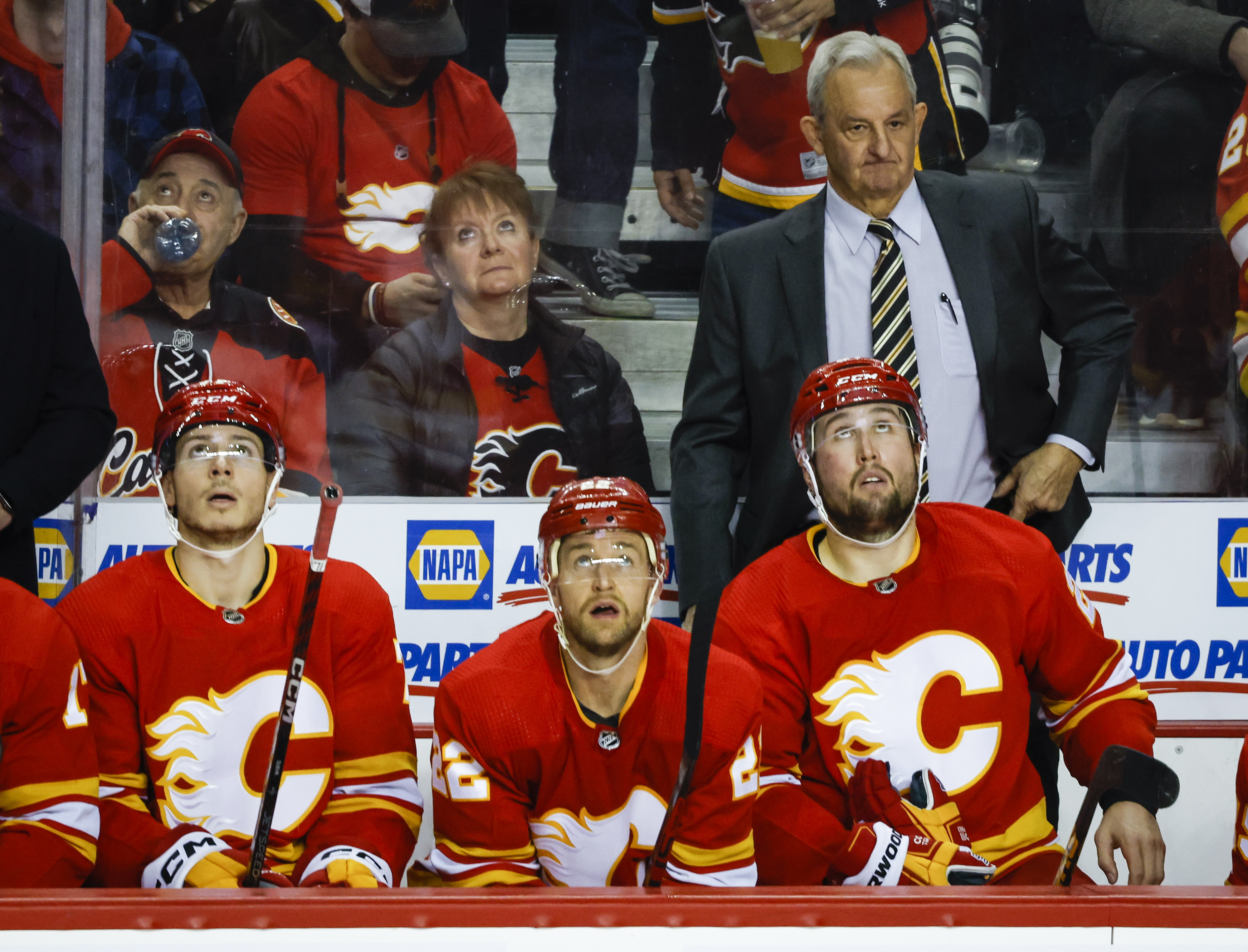 Calgary Flames head coach Darryl Sutter, top right, reacts after the Chicago Blackhawks scored a goal during the third period of an NHL hockey game, Tuesday, April 4, 2023 in Calgary, Alberta.