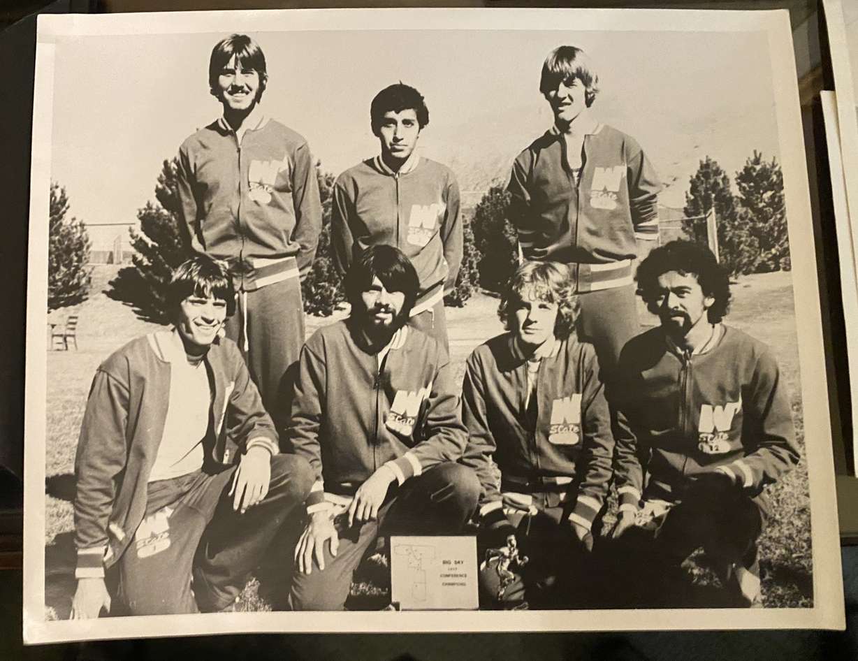 Javier Chaevz Sr., bottom second from left, and other members of the Weber State University track team pose for a photo.