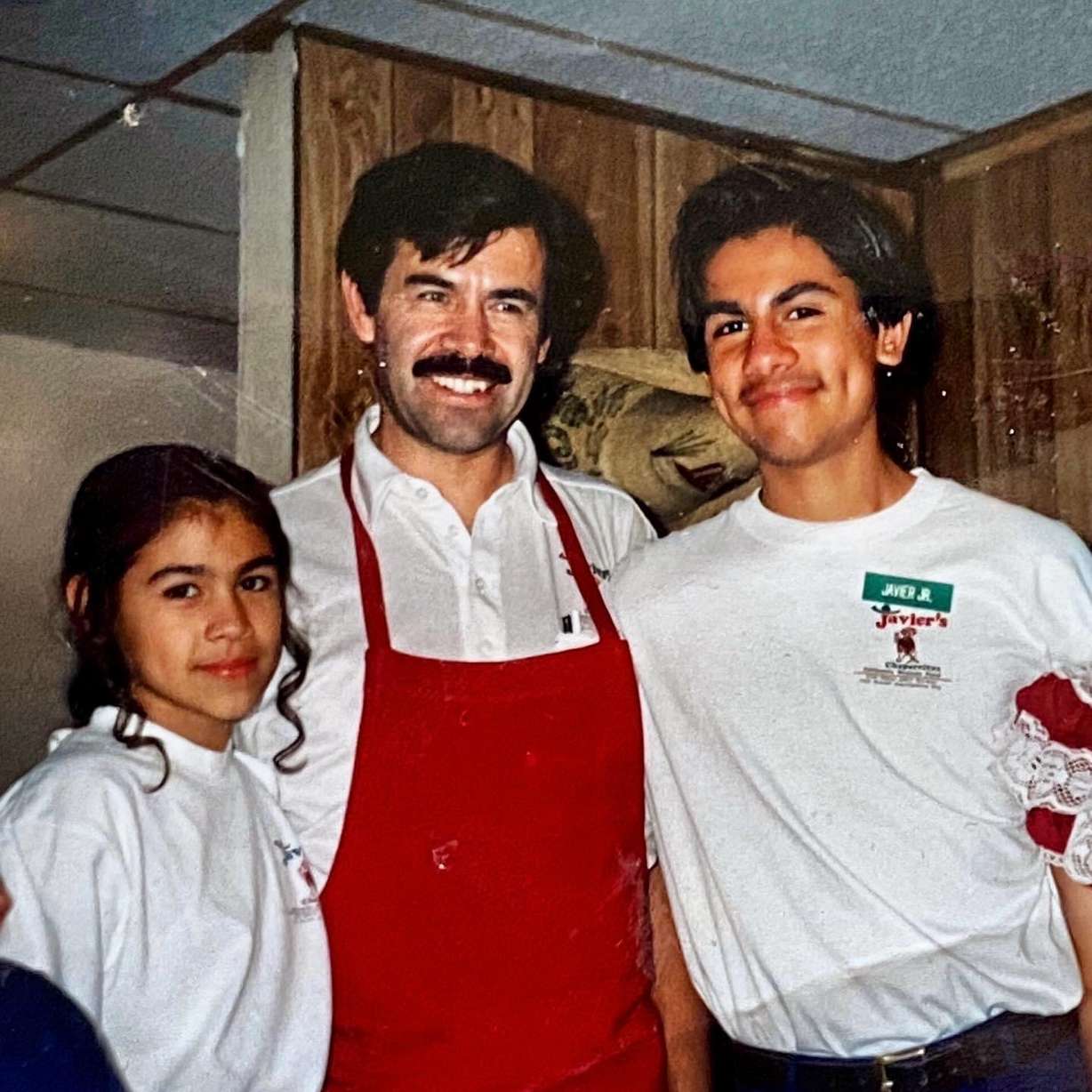 Javier Chavez Sr., center, with his children Javier Chavez Jr., right, and Amada Materre, left, pose for a photo together around 1998 at the original location of Javier's Authentic Mexican Food on 29th Street in Ogden.