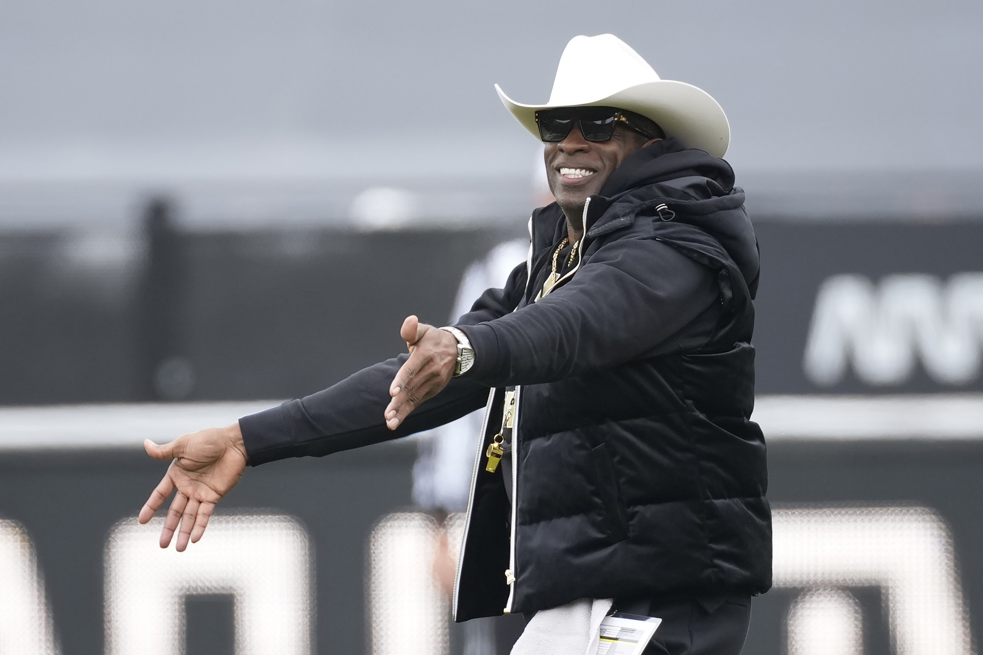 FILE - Colorado head coach Deion Sanders gestures in the first half of the team's spring practice NCAA college football game Saturday, April 22, 2023, in Boulder, Colo. The spring transfer window for college football players closed with 43 scholarship players -- the equivalent of half a roster -- from coach Deion Sanders' Colorado program having entered the portal since the spring game was played on April 15. 